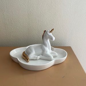 This is a unicorn jewelry holder!